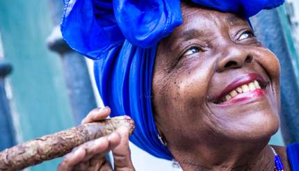 Portrait of cuban woman smoking cigar in Havana, Cuba