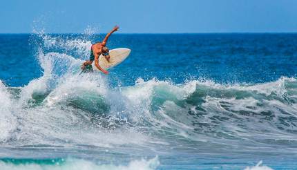 Surfer riding the waves of Costa Rica