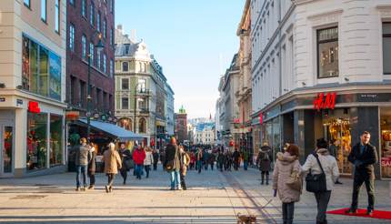 Shopping in Oslo - H&M on the right and other retail stores on the left of the street