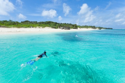 Snorkellers paddle towards one of Okinawa's ubiquitous beaches