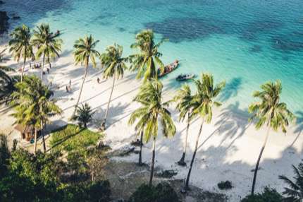 You can sit on a beach and work in Ko Samui, Thailand.